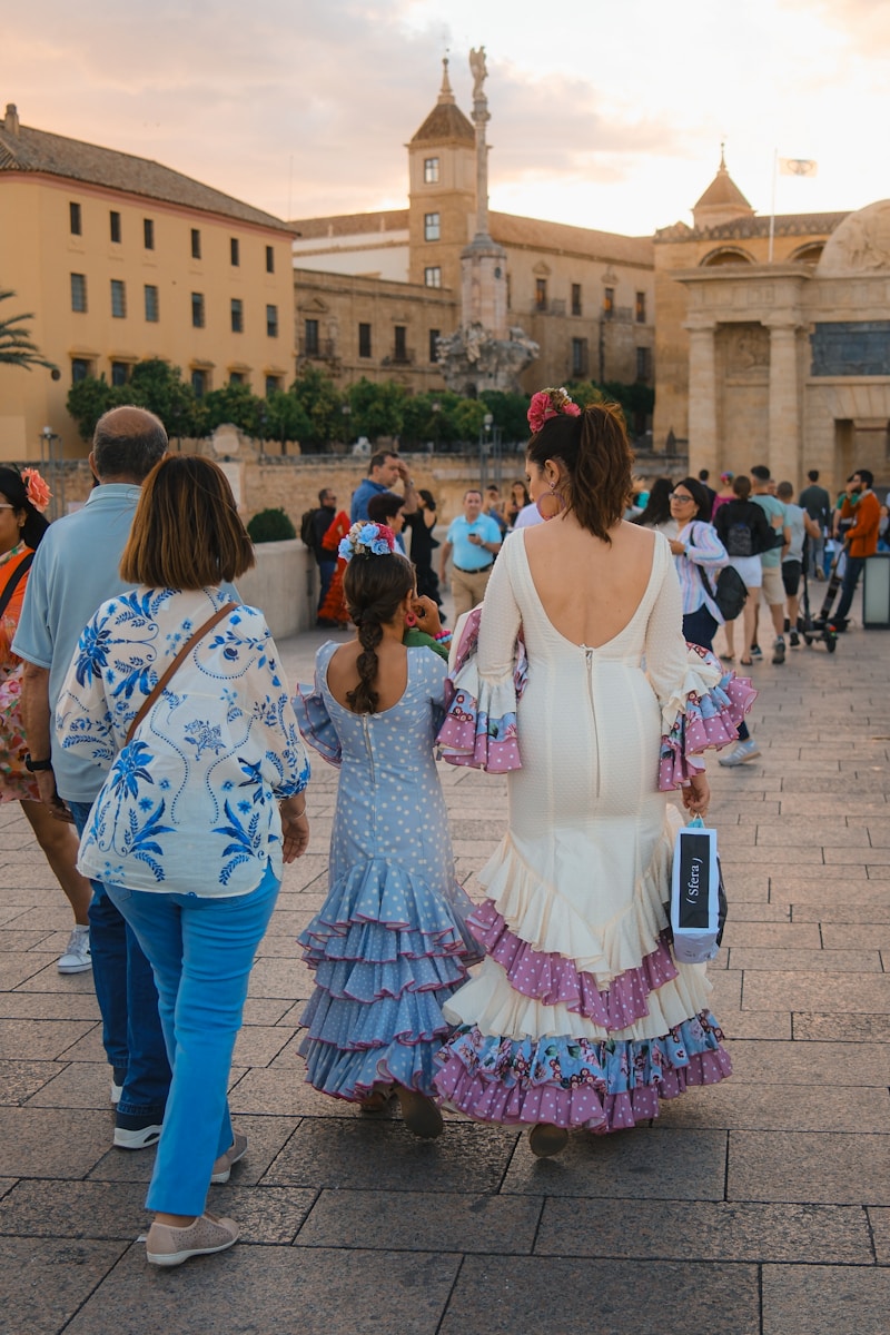 A group of people walking down a street